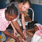 Medical volunteer Lydia Hartsell assists with a birth in rural Dodoma, Tanzania.